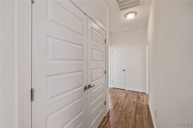 hallway featuring hardwood / wood-style floors