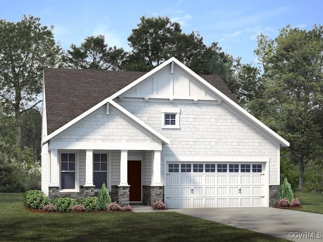 view of front of house with a front yard and a garage