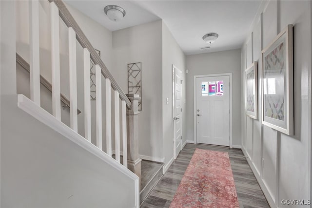 foyer entrance featuring dark hardwood / wood-style floors