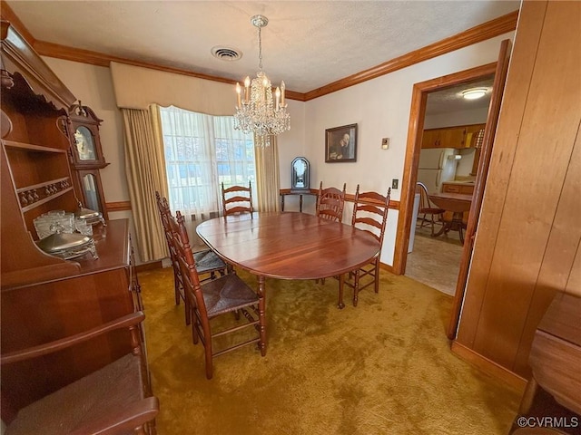 dining room with light colored carpet, crown molding, and a chandelier