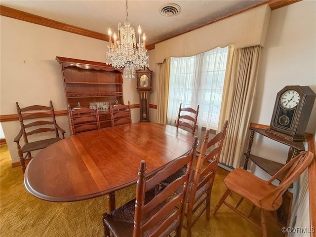 carpeted dining room with ornamental molding and an inviting chandelier