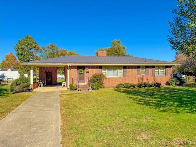 ranch-style home with a carport and a front lawn