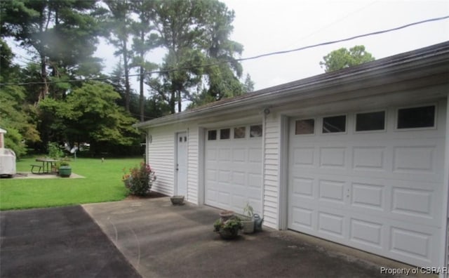 garage with a lawn