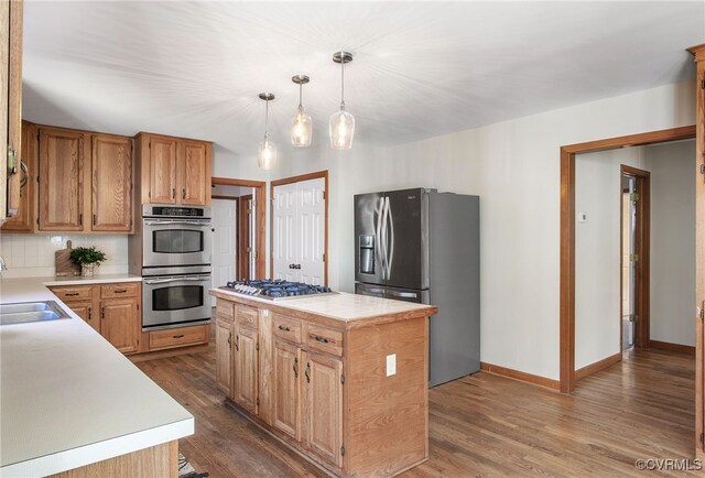 11741 Riverpark Dr, Chesterfield, VA 23838 - kitchen featuring light countertops, appliances with stainless steel finishes, and dark wood finished floors