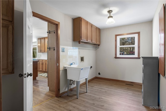 11741 Riverpark Dr, Chesterfield, VA 23838 - laundry area with baseboards, washer hookup, light wood-style floors, cabinet space, and electric dryer hookup