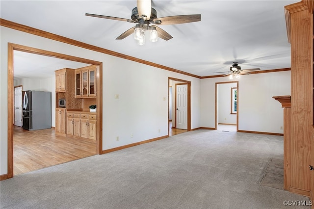 11741 Riverpark Dr, Chesterfield, VA 23838 - unfurnished living room featuring ornamental molding, a ceiling fan, and light carpet
