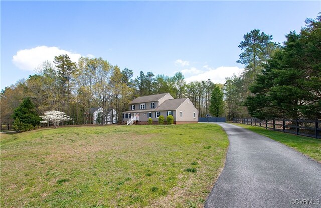 11741 Riverpark Dr, Chesterfield, VA 23838 - view of front of house featuring a front lawn, fence, and driveway