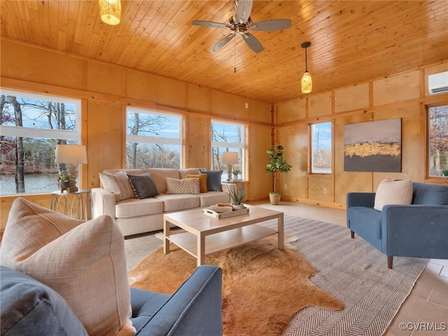 tiled living room with an AC wall unit, ceiling fan, wooden ceiling, and wood walls