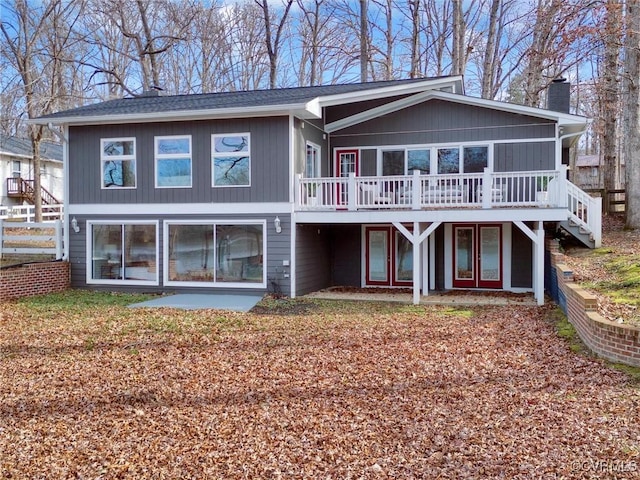 back of house featuring a deck