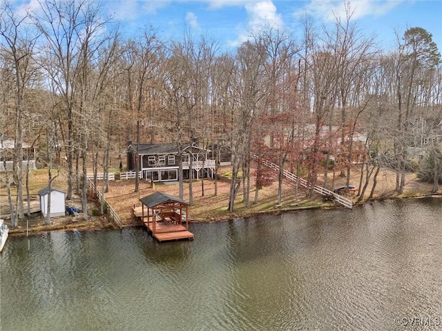 view of dock featuring a deck with water view