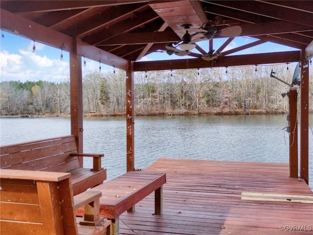 view of dock with a gazebo and a water view