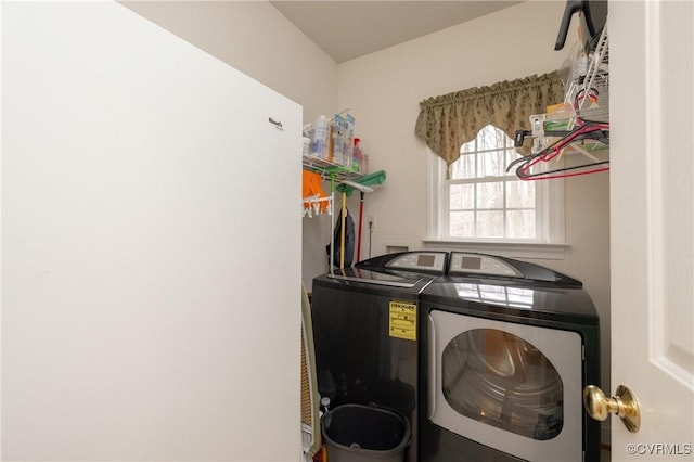 washroom with washing machine and dryer