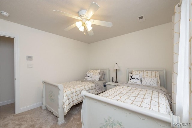 bedroom featuring ceiling fan and light colored carpet