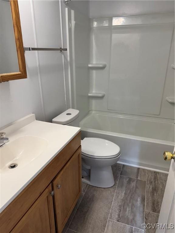 full bathroom featuring vanity, toilet, and shower / tub combination