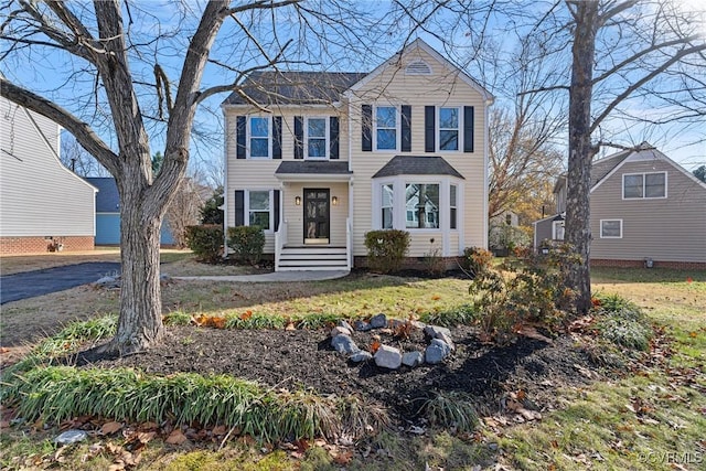 view of front of property with a front lawn