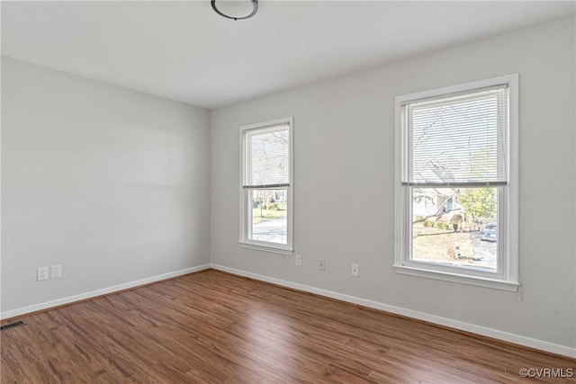 empty room with wood-type flooring