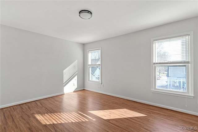 spare room with hardwood / wood-style flooring