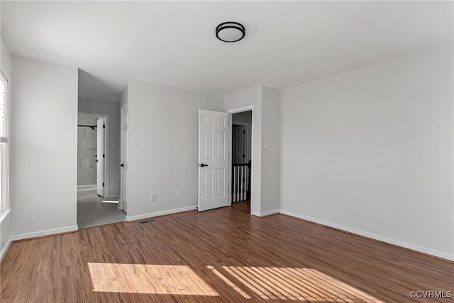 spare room featuring hardwood / wood-style floors