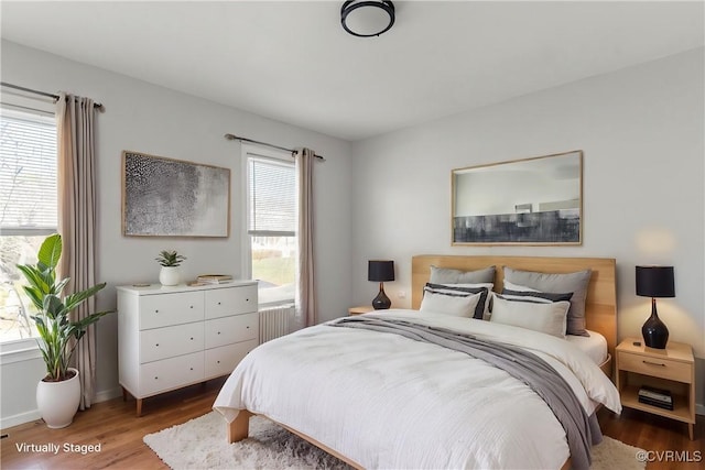 bedroom with wood-type flooring