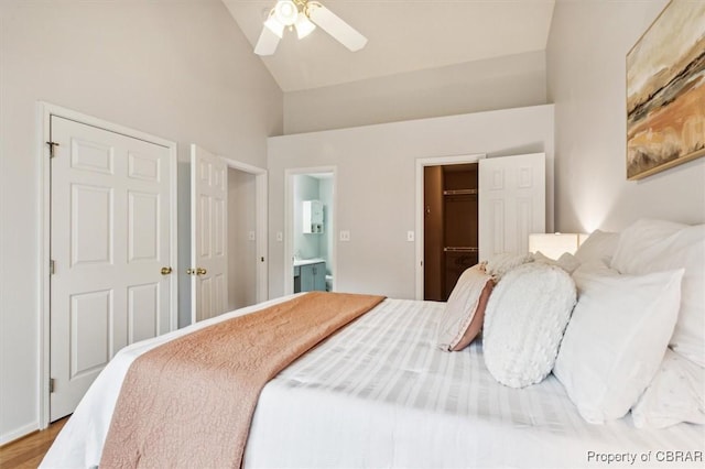 bedroom with connected bathroom, ceiling fan, a spacious closet, high vaulted ceiling, and hardwood / wood-style floors