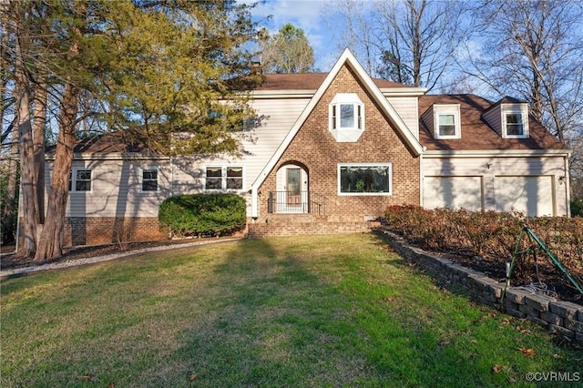 view of front of property featuring a garage and a front lawn