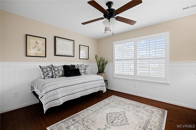 bedroom featuring dark hardwood / wood-style flooring and ceiling fan