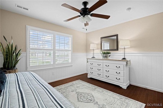 bedroom featuring ceiling fan and dark wood-type flooring