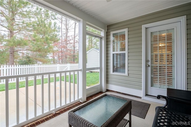 sunroom / solarium featuring a healthy amount of sunlight