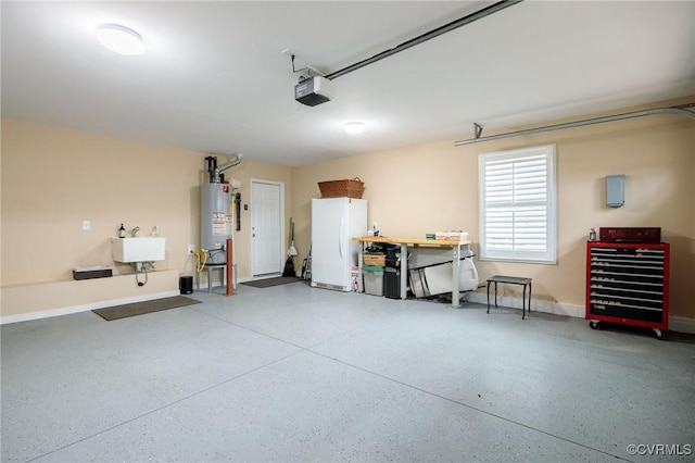 garage with white fridge, sink, a garage door opener, and water heater