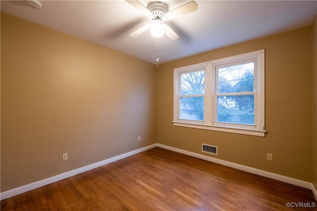 unfurnished room featuring ceiling fan and hardwood / wood-style floors