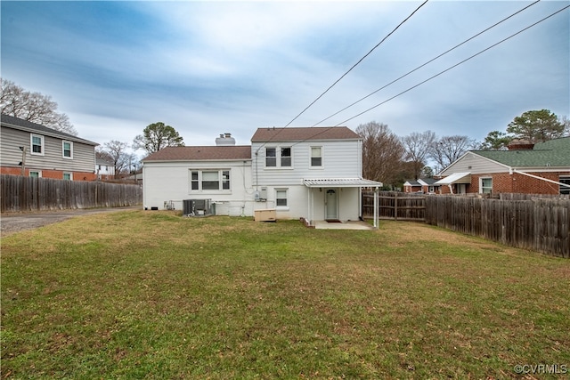 rear view of property with a pergola, a yard, cooling unit, and a patio area