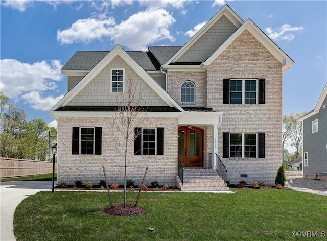 view of front facade with french doors and a front lawn