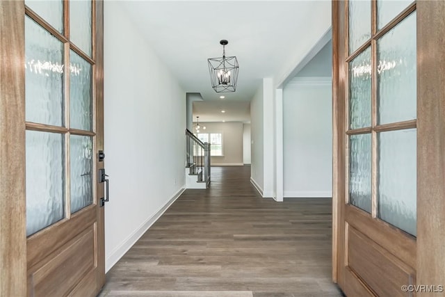 interior space with dark hardwood / wood-style flooring and a chandelier