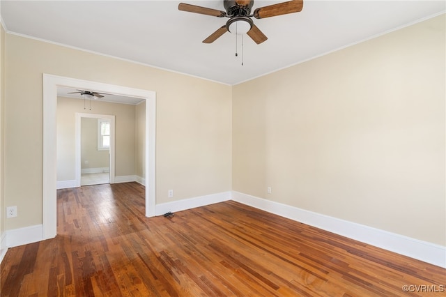 spare room featuring crown molding, ceiling fan, and wood-type flooring