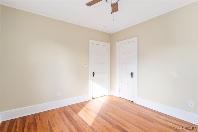 unfurnished bedroom with ceiling fan and light hardwood / wood-style floors