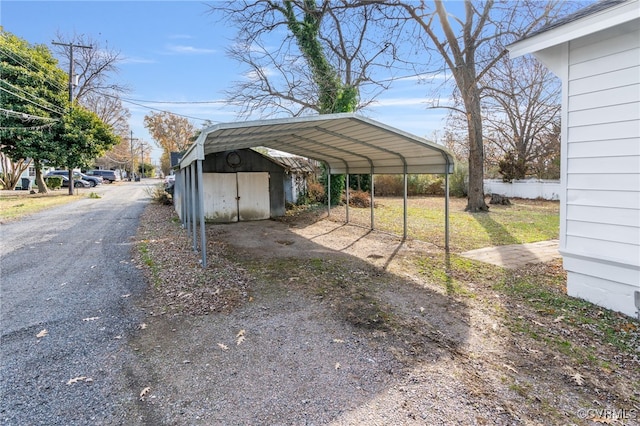 view of vehicle parking with a carport