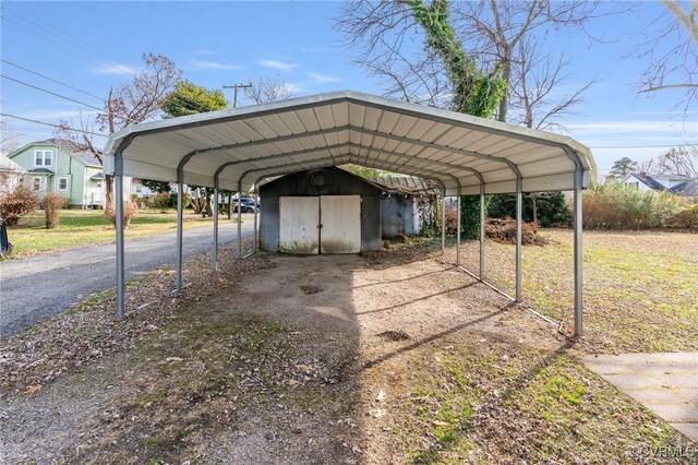 view of vehicle parking featuring a carport