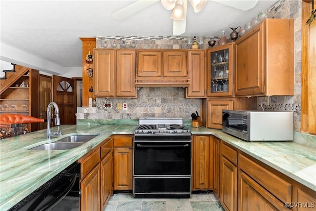 kitchen with decorative backsplash, ceiling fan, sink, dishwasher, and range