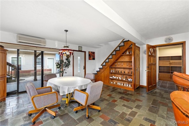 dining space with a wall unit AC