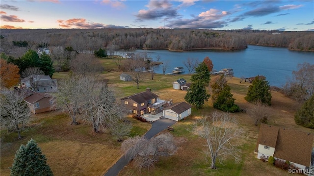 aerial view at dusk with a water view