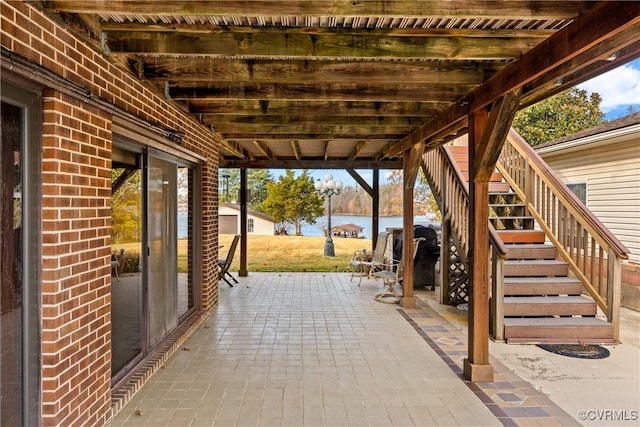 view of patio / terrace with a water view