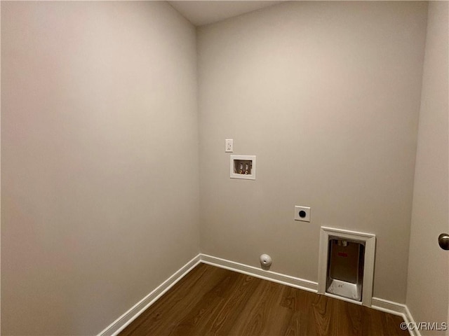 clothes washing area with hardwood / wood-style floors, electric dryer hookup, hookup for a gas dryer, and washer hookup