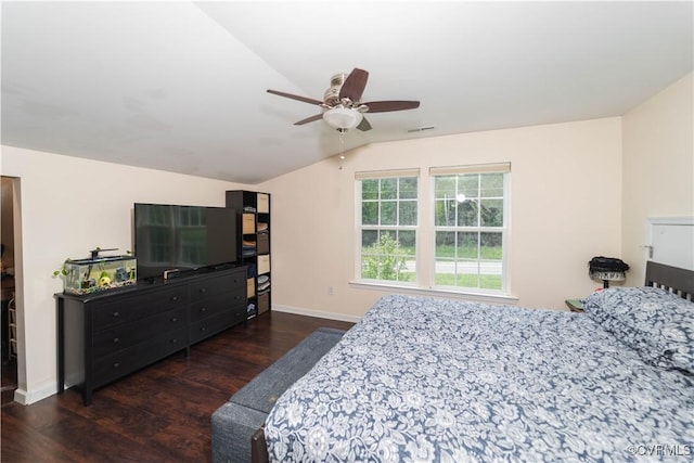 bedroom with ceiling fan, dark hardwood / wood-style flooring, and lofted ceiling