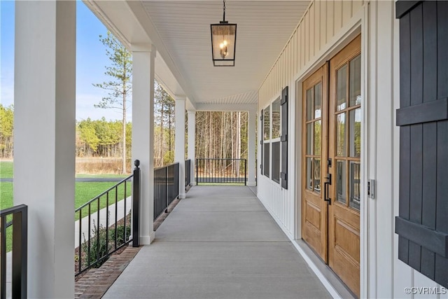 view of patio / terrace with covered porch and french doors