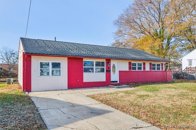 ranch-style home with central AC and a front lawn