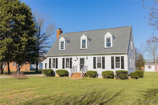 cape cod home with a front lawn