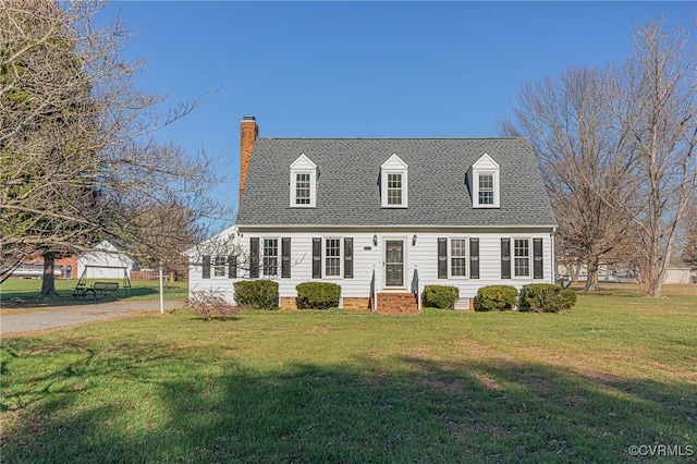 cape cod house featuring a front lawn