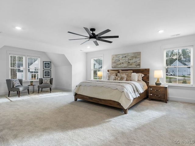 carpeted bedroom featuring recessed lighting, visible vents, and baseboards