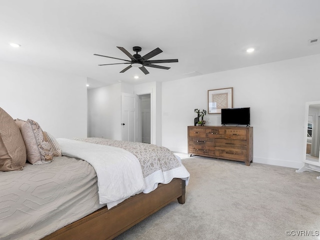 bedroom featuring baseboards, visible vents, a ceiling fan, light colored carpet, and recessed lighting