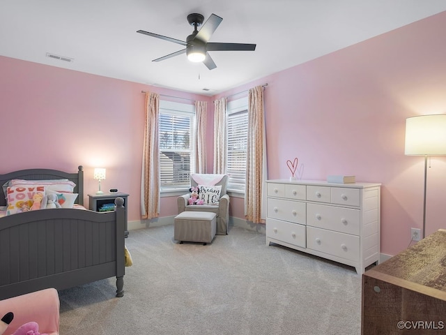 bedroom featuring light carpet, baseboards, visible vents, and ceiling fan